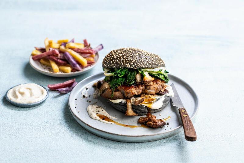 Black hamburger bun with sesame presliced